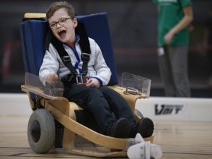 A photo of Zach in a Volt Hockey chair.