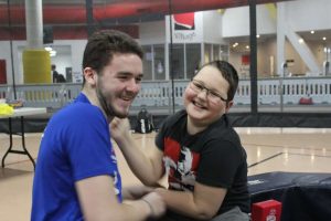 A photo of Gavin smiling with Variety employee, Taurin.