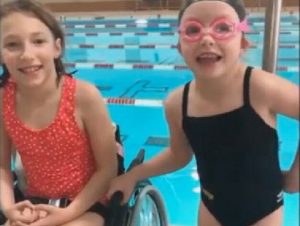 An image of Madi and Victoria by the Variety Village Pool