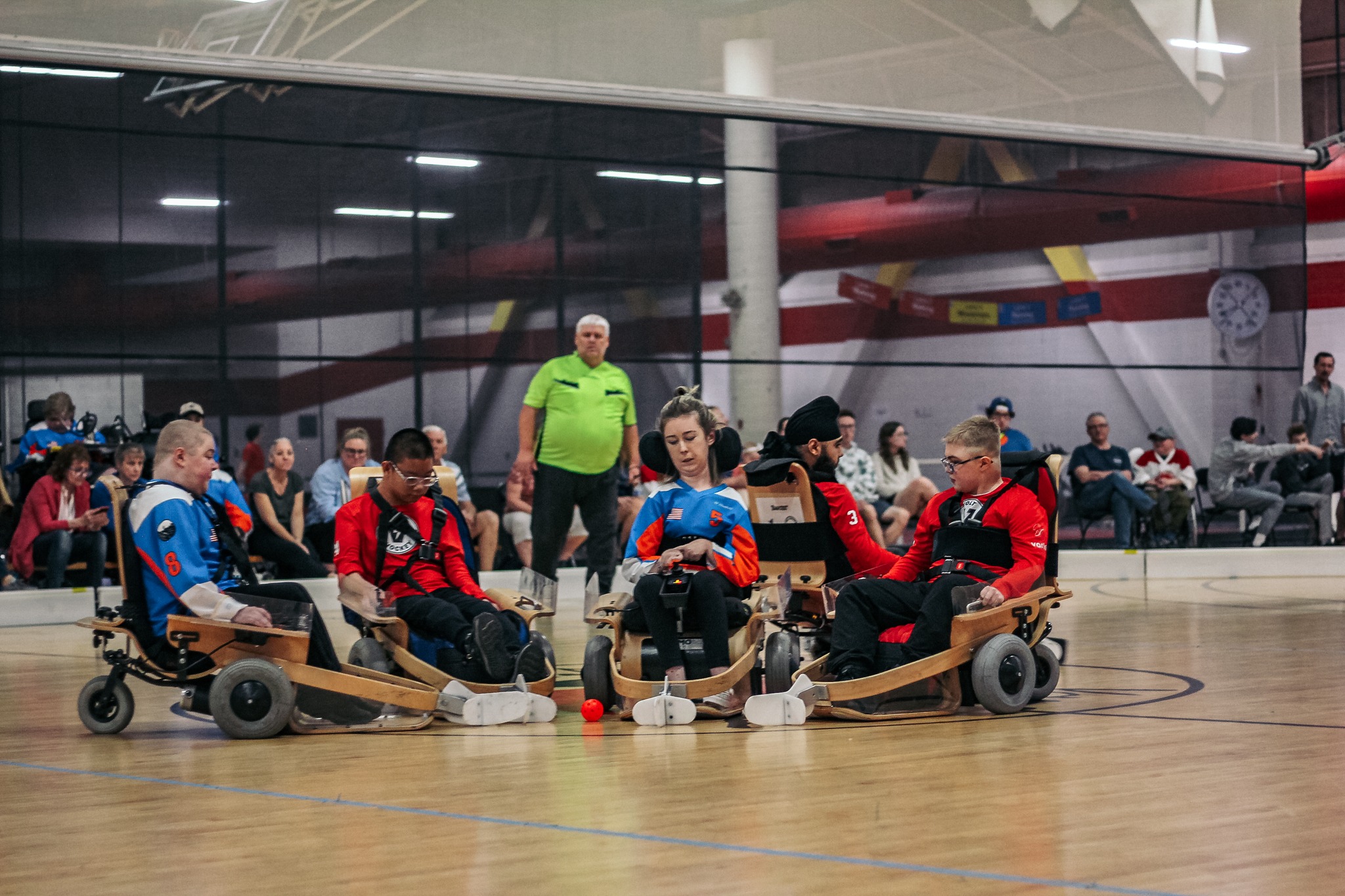 A group of young boys and girls playing volt hockey