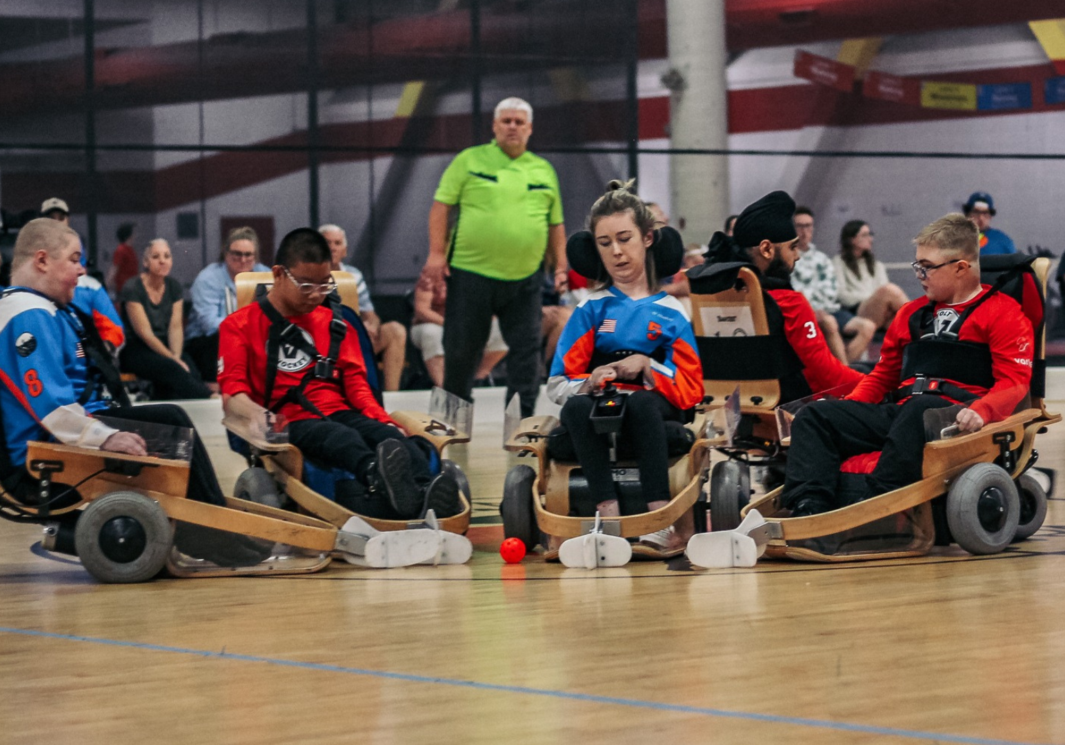 A group of young boys and girls playing volt hockey